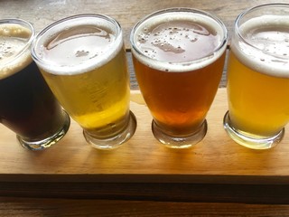Beer samples on wooden board