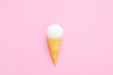 Composition of ice cream cone with bath ball on a light pink background. Bathroom cosmetic accessories. Sea salt. Flat Lay. Top View
