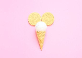 Composition of ice cream cone with bath ball on a light pink background. Bathroom cosmetic accessories. Sea salt. Flat Lay. Top View