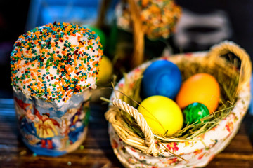Easter cake and painted eggs in the basket