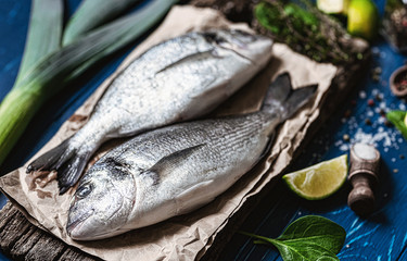 fresh raw dorado fish with spices. dinner for two with your loved one with your own hands.