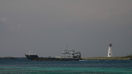Tanker boat and lighthouse