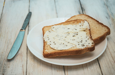 Fresh crisp morning toast with  creamy cheese and herbs