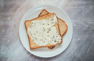 Fresh crisp morning toast with  creamy cheese and herbs