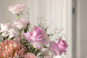 Bouquet of lilac roses and other flowers