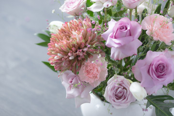 Bouquet of lilac roses and other flowers