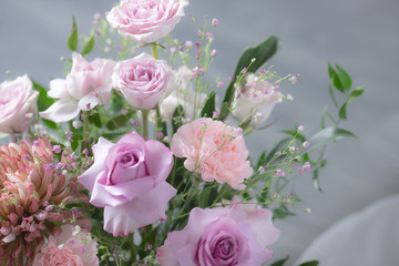 Bouquet of lilac roses and other flowers