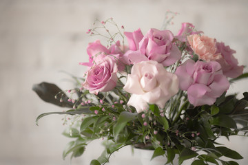 Bouquet of lilac roses and other flowers