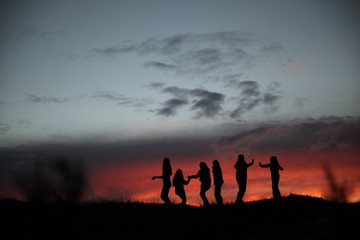 happy people playing game at sunset.turkey 