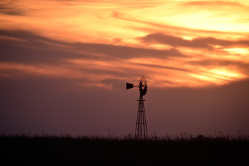 Windmill in the field, at sunset, Pampas, Argentina