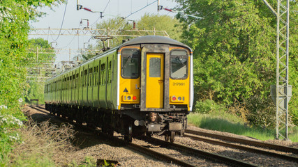 Fototapeta premium English Yellow Face train on branch line in hertfordshire