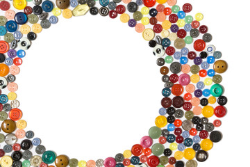 background with round frame - multicolored buttons on a white surface