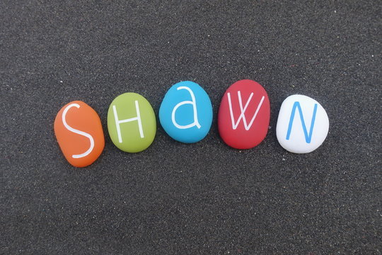 Shawn, masculine given name composed with colored stones over black volcanic sand