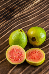 close up on guavas, wooden background