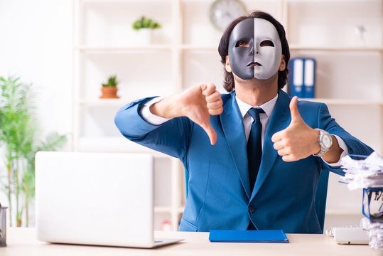 Male employee in the office in industrial espionage concept