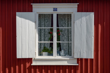 Fototapeta premium Window of a falu red house in Gammelstaden, Sweden