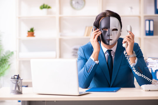 Male employee in the office in industrial espionage concept