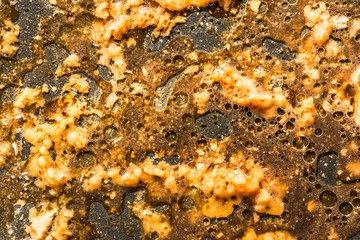 Obraz na płótnie Canvas Fat residues in the pan, dirty frying pan
