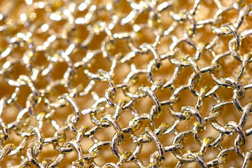 Close Up Of Gold Fabric Chain mail Sewing