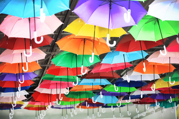 variety colorful umbrella decorate on roof