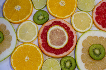 Citrus fruit slices on table