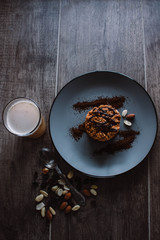 Anthill cake with chocolate and coffee on a dark background. Dessert with nuts and raisins. Bolo formigueiro. Russian funnel cake recipe.