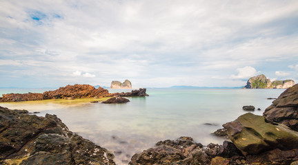 Long exposure shot. Sea scape with stone beach at sunset, Motion blur, slow shutter speed