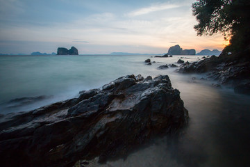 Long exposure shot. Sea scape with stone beach at sunset, Motion blur, slow shutter speed