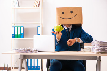 Happy man employee with box instead of his head