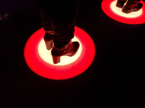 Luminous LED circles that illuminate when stepped on in different colors.
