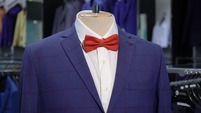 Luxury men fashion suit displaying on mannequin in store
