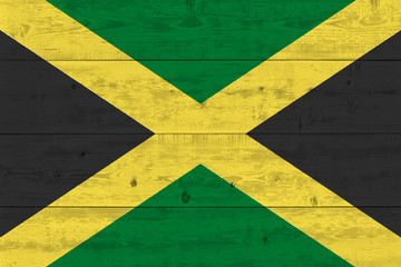 Jamaica flag painted on old wood plank