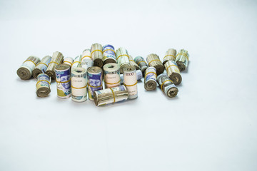 Rolls and Bundles of Naira Cash local currencies in a pyramid heap