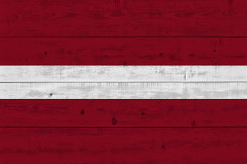 latvia flag painted on old wood plank