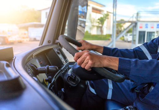Truck driver keeps driving with hands