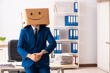 Happy man employee with box instead of his head
