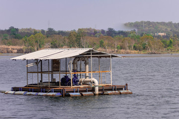 A floating water pump in a lake in Thailand