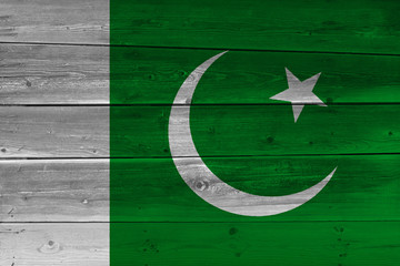 Obraz na płótnie Canvas Pakistan flag painted on old wood plank