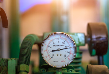 Pressure gauge connection to air compressor in service center,Closeup pressure gauge.