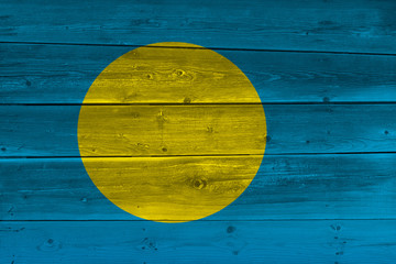 Palau flag painted on old wood plank