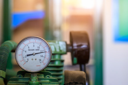 Pressure gauge connection to air compressor in service center,Closeup pressure gauge.