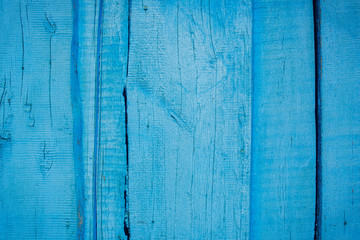 Fototapeta na wymiar Abstract wood background with cracked paint. Can be used as a poster or background for design. Free space for inscriptions.