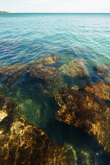Fototapeta na wymiar Lake Michigan as seen from the shore in Chicago, showing rock at the bottom through the clear water.