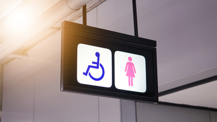 The women's restroom sign at the airport.