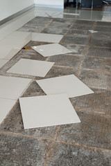 Ceramic tiles and tools for tiler. Floor tiles installation. Home improvement, renovation