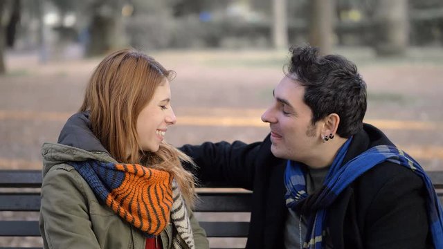 First date in the park. young man refuse kissing, gently woman
