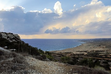 Beautiful seascape with stones on the foreground. Blue water and rocky coast in a sunny day. Ayia Napa, Cape Greco National Forest Park, Cyprus.