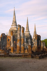 Fototapeta premium View of the ruins of the Buddhist temple of Wat Phra Sri Sanphet in the early morning. Ayutthaya, Thailand