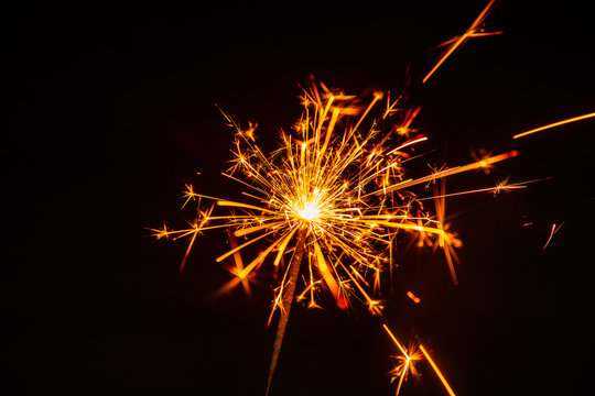 Hot Fire Sparks Explosive Fuse And Flash From Welding Isolated On Black.