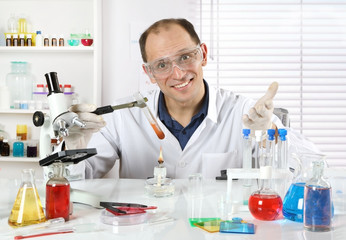 Happy scientist conducting research in a chemical laboratory
